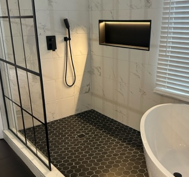 After luxury bathroom remodel with freestanding tub and wet area