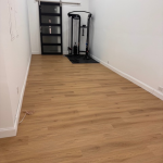 Modern basement rec room with LVP flooring and LED lighting completed by i-Renovate in Canton GA